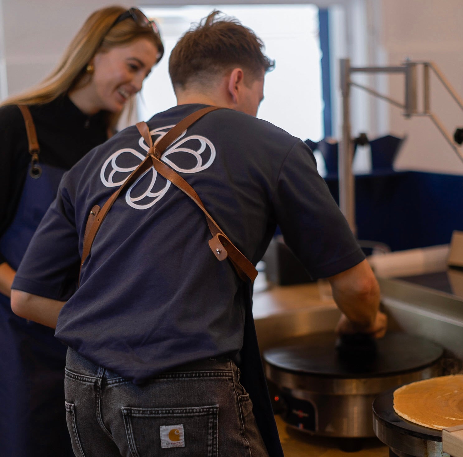 Siblings Robin and Joline preparing Handmade Crêpes in their LAMOUR Crêperie in Prenzlauer Berg, Berlin, right at Helmholtzplatz.